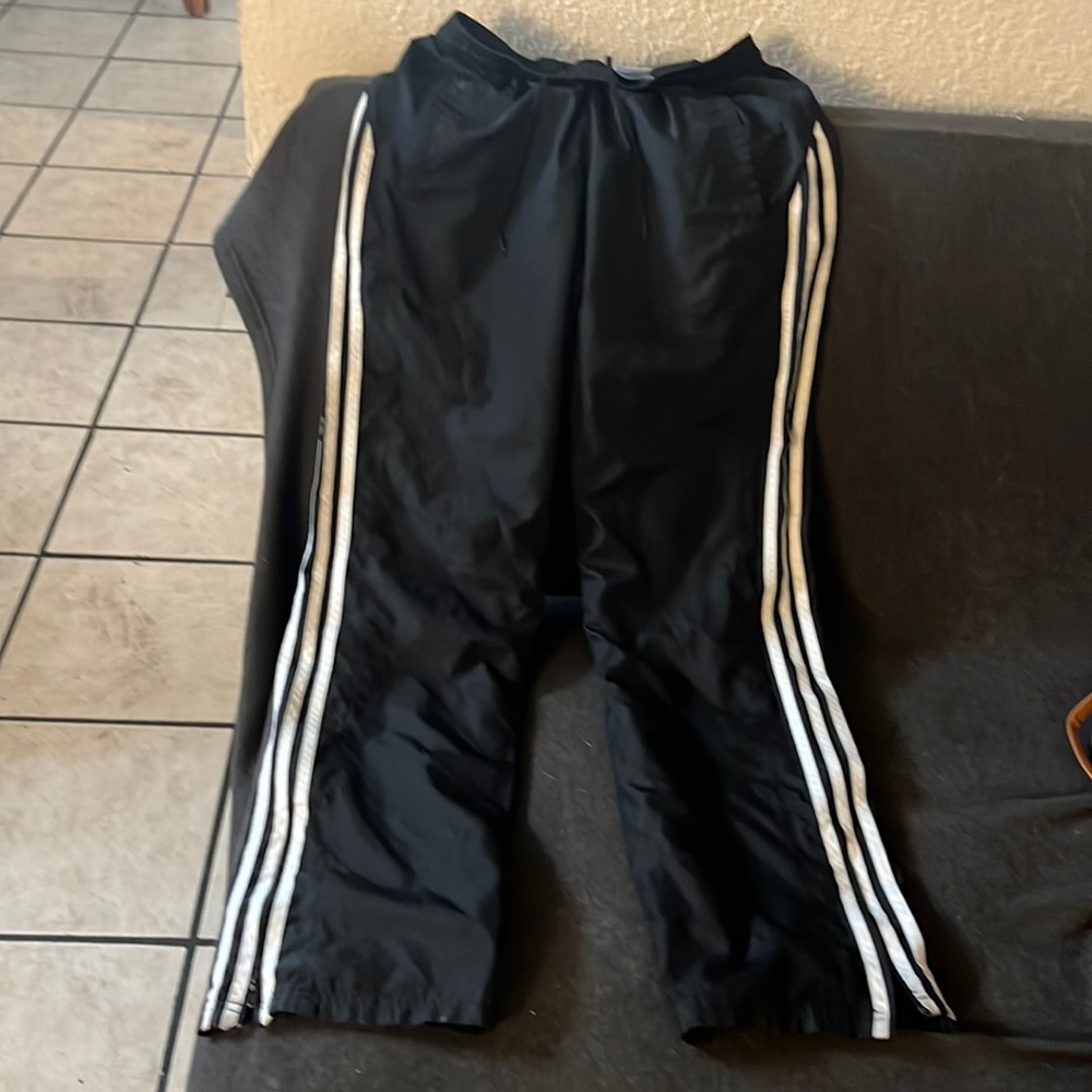 Vintage adidas women’s black with white stripes polyester pants with side zipper